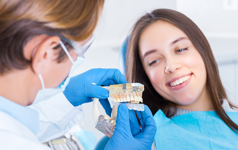 Dentist explaining how to use mouth guard