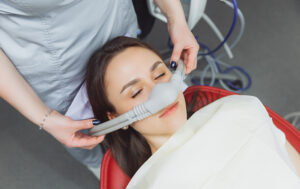 Sedation mask being placed on patient's nose